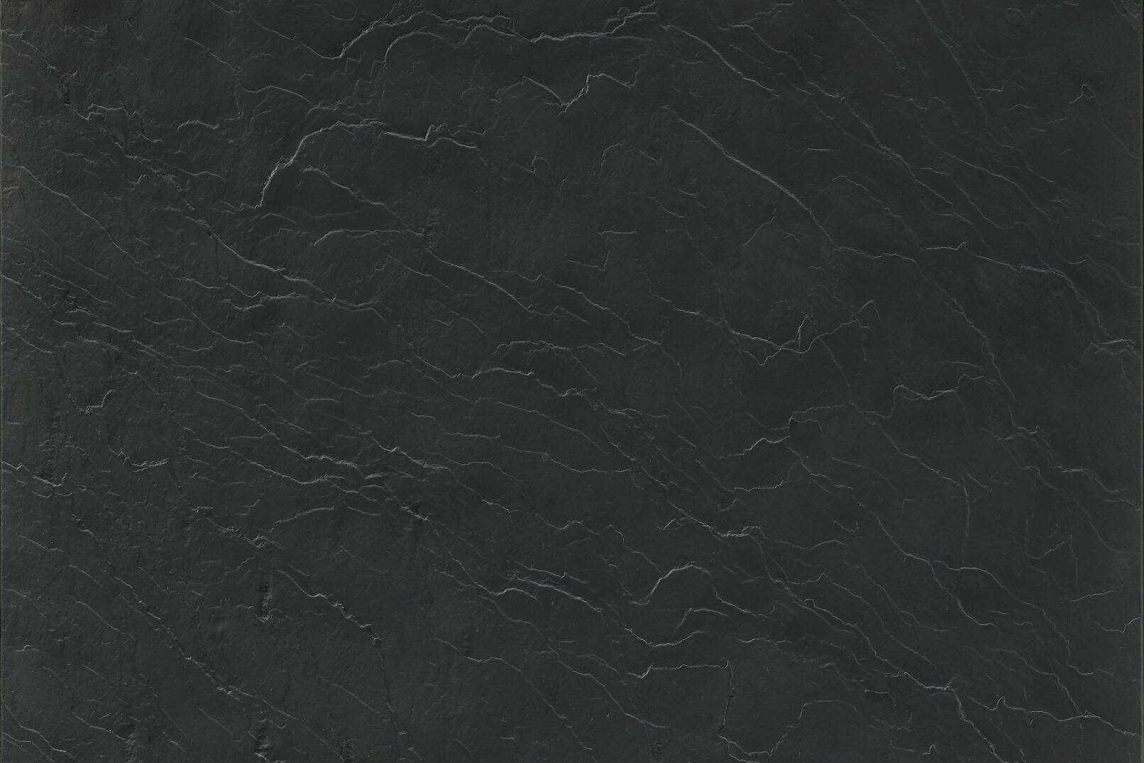 Hệ tủ bếp cao cấp Nolte Küchen neoSLATE Schiefer TiefSchwarz — mặt tủ veneer đá phiến thật màu đen sâu, bề mặt ba chiều độc đáo, mỗi tấm là một độc bản. Nhà sản xuất: Nolte Küchen, CHLB Đức | Phân phối độc quyền bởi Eleganz Furniture Vietnam.